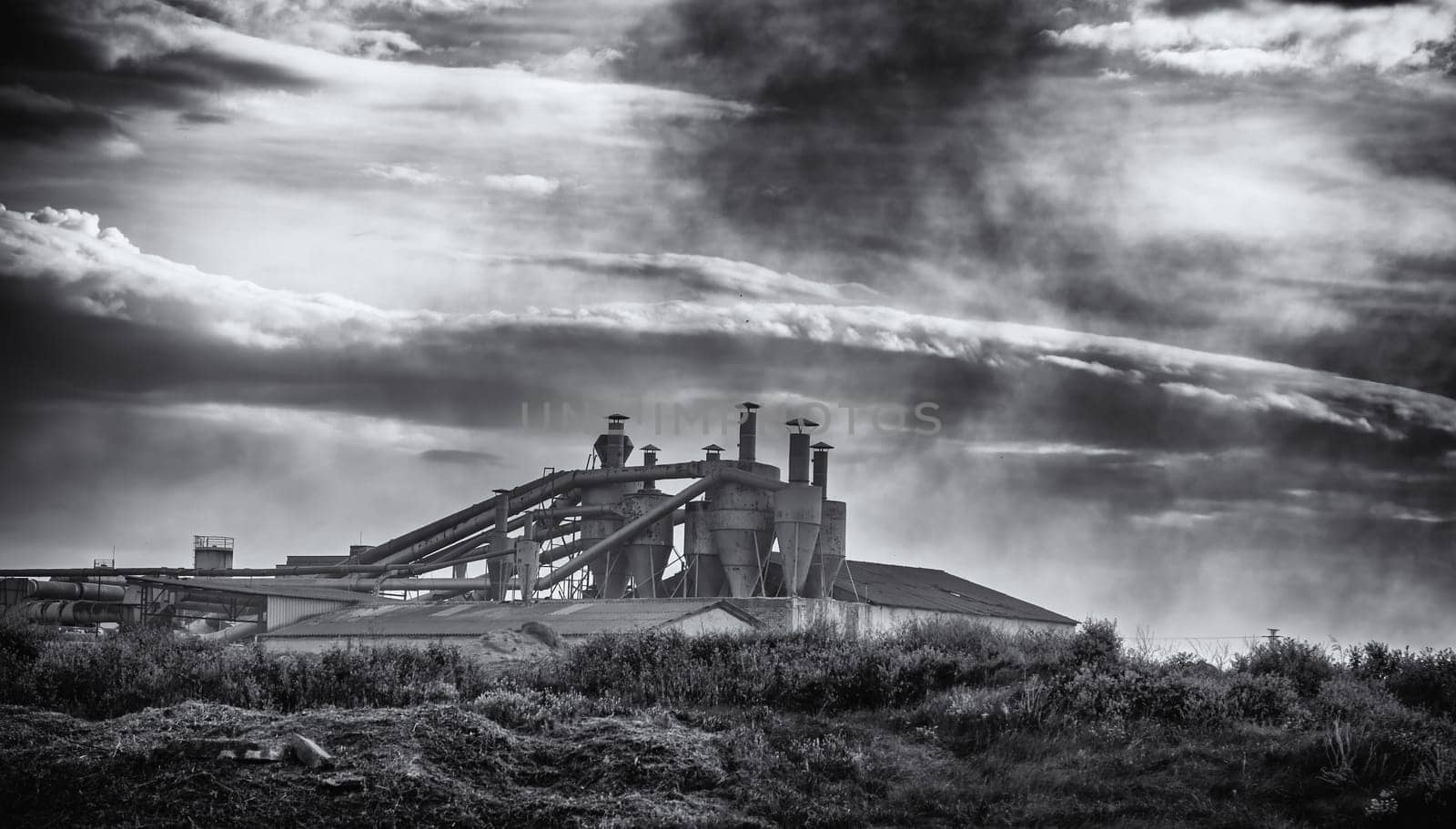 Detail of old industrial factory on a cold stormy day, pollution