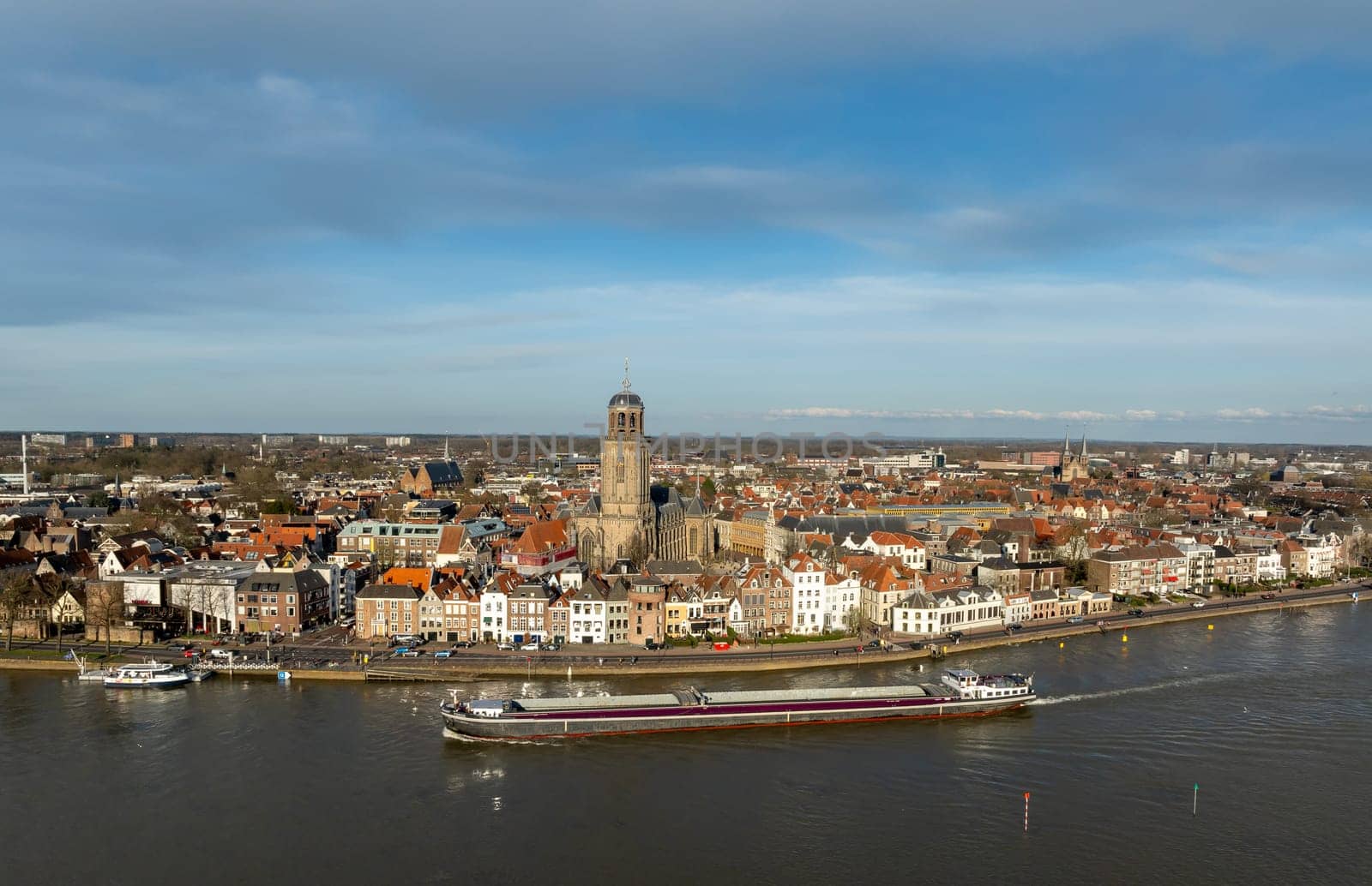 aerial panoramic shot of the Dutch city of Deventer, along the IJssel river.