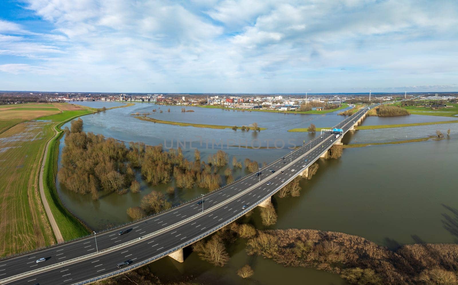 A1 (E30) highway over the IJssel river seen from the air. It is the main east-west connection between Germany and West Netherlands.