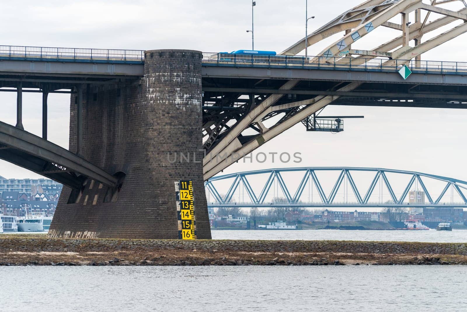 Pillar of the Waal bridge at Nijmegen, Netherlands with water level indicator