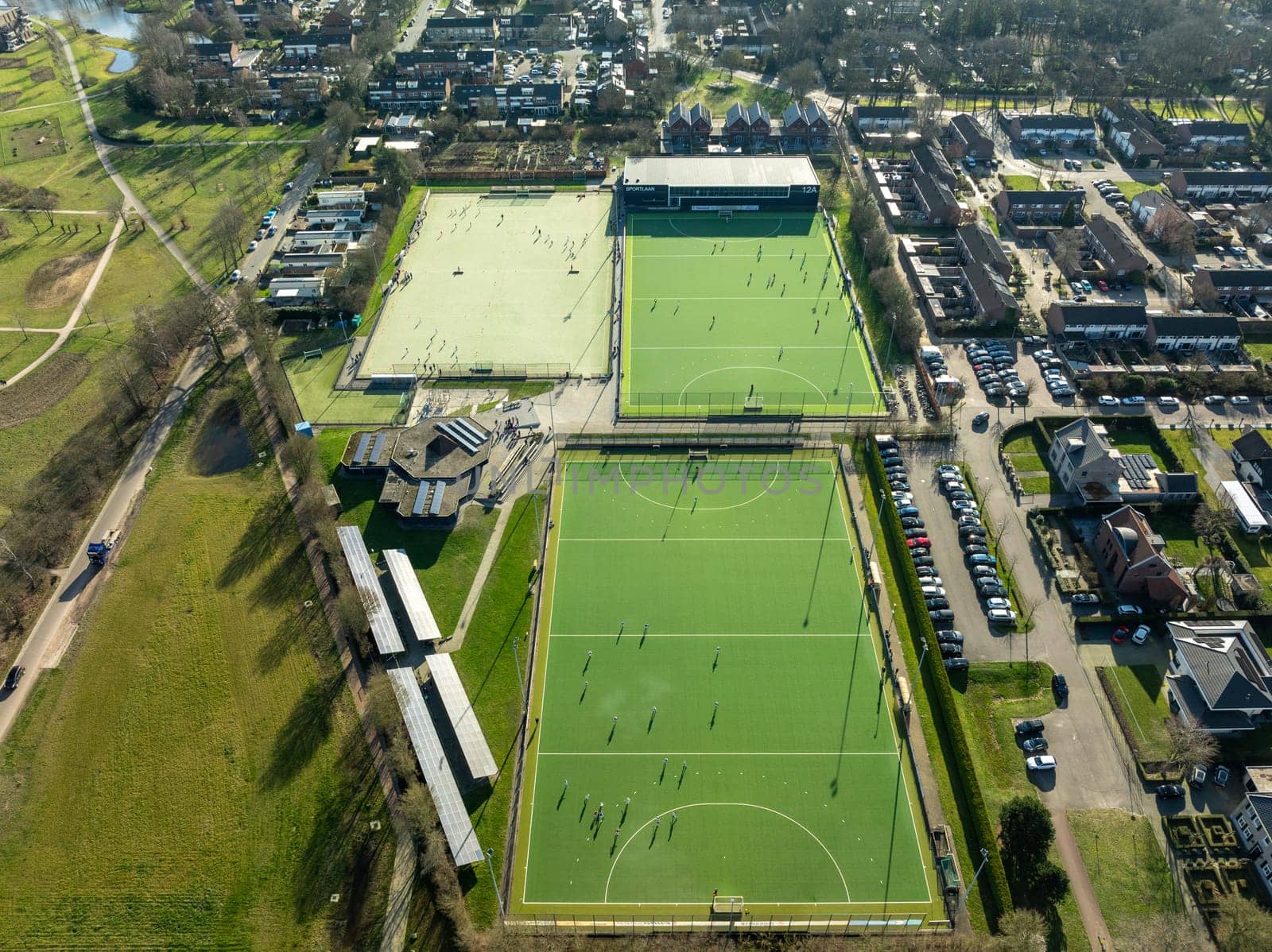 aerial shot of a sports field with people playing on it