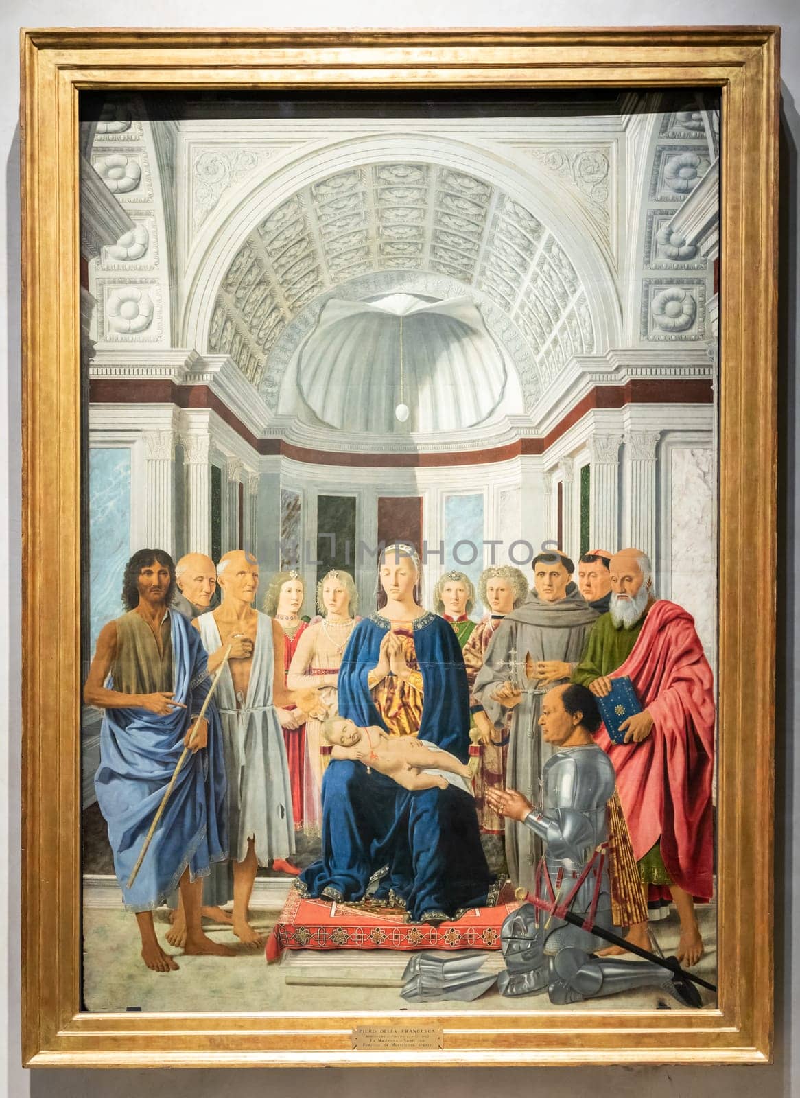 Milan, Italy - 23 September 2023: Brera antique painting museum. Madonna and child with saints, angels and Federico da Montefeltro, by painter Piero della Francesca, 1470