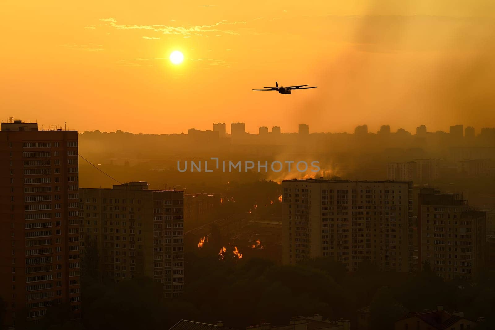 Plane drone over burning city at sunset or sunrise. Neural network generated image. Not based on any actual scene or pattern.