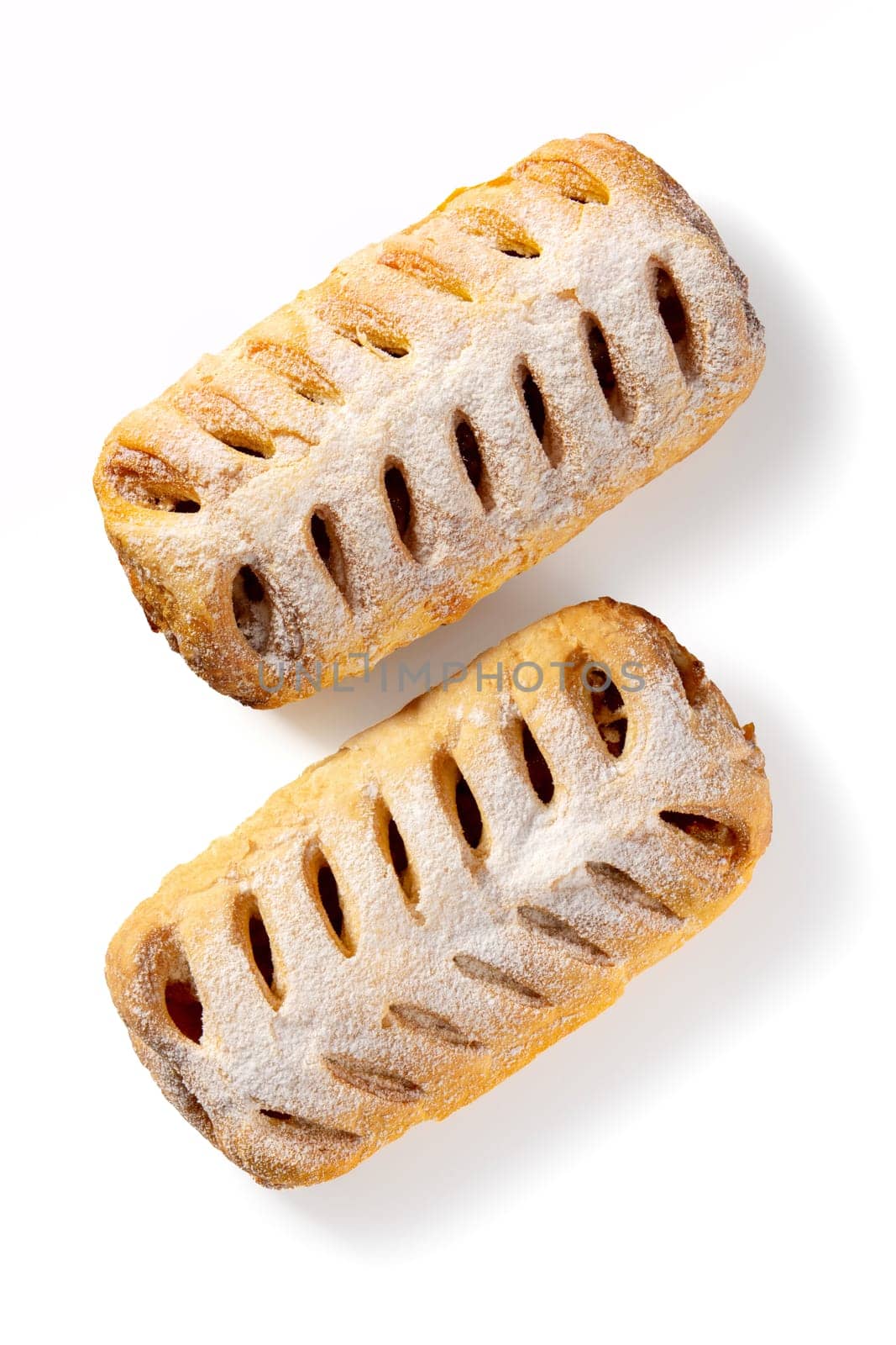 Behold the harmonious duo of apple strudels, an epitome of homemade sweetness on white. With a golden crust and luscious apple filling, they beckon with the promise of delectable delight.