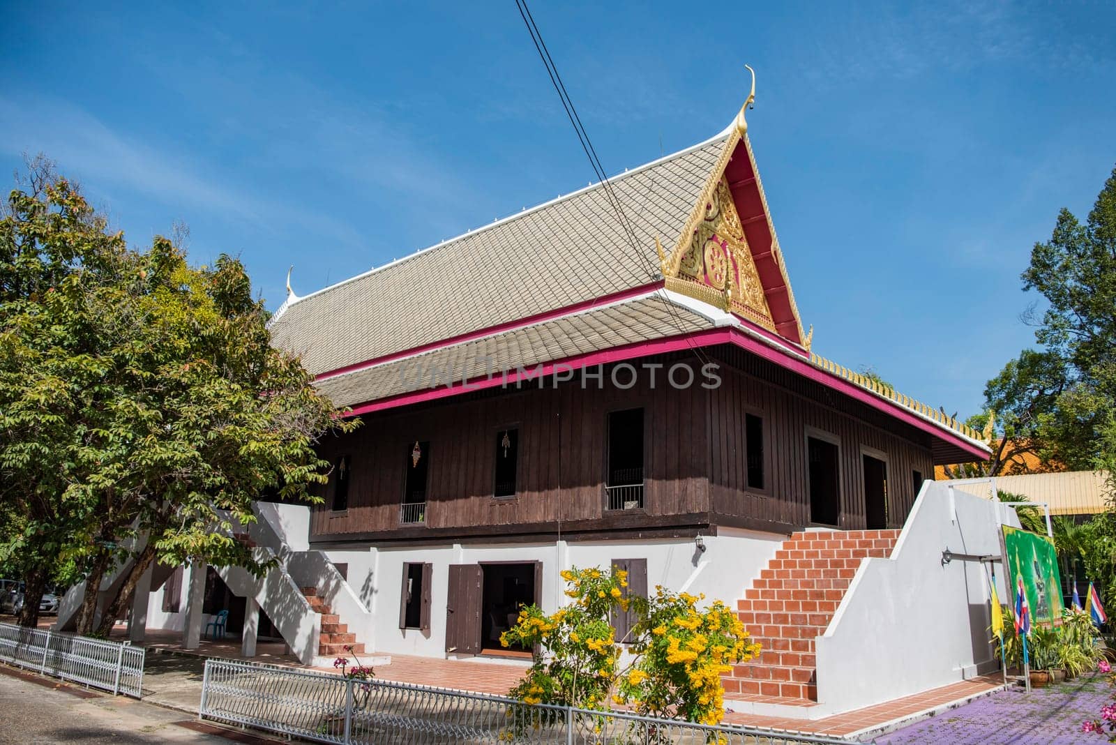 a old Wood House at Wat Mani Wanaram in the city centre of Udon Ratchathani and Province Ubon Ratchathani in Thailand.  Thailand, Ubon Ratchathani, November, 23, 2023