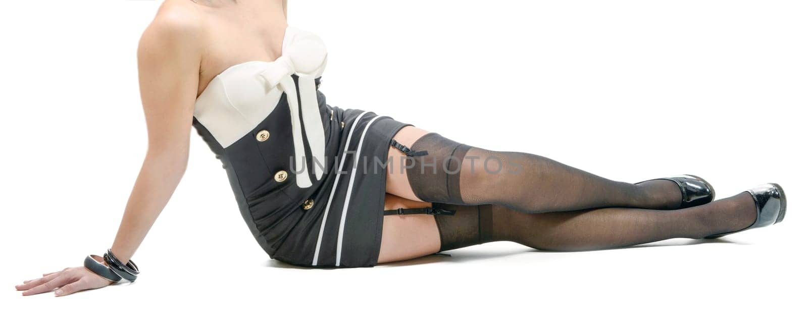 Beautiful  woman with pin-up style lying on white background.