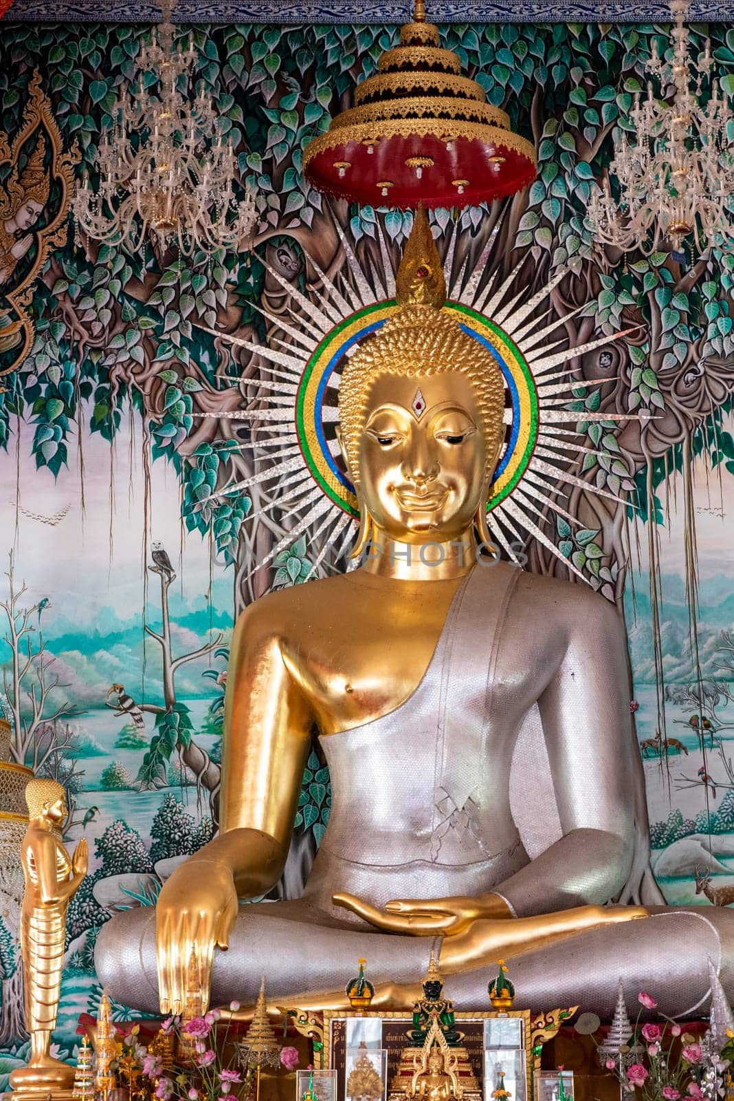 a Buddha inside of Wat Ban Na Kwai in city centre and Province Ubon Ratchathani in Thailand.  Thailand, Ubon Ratchathani, November, 24, 2023