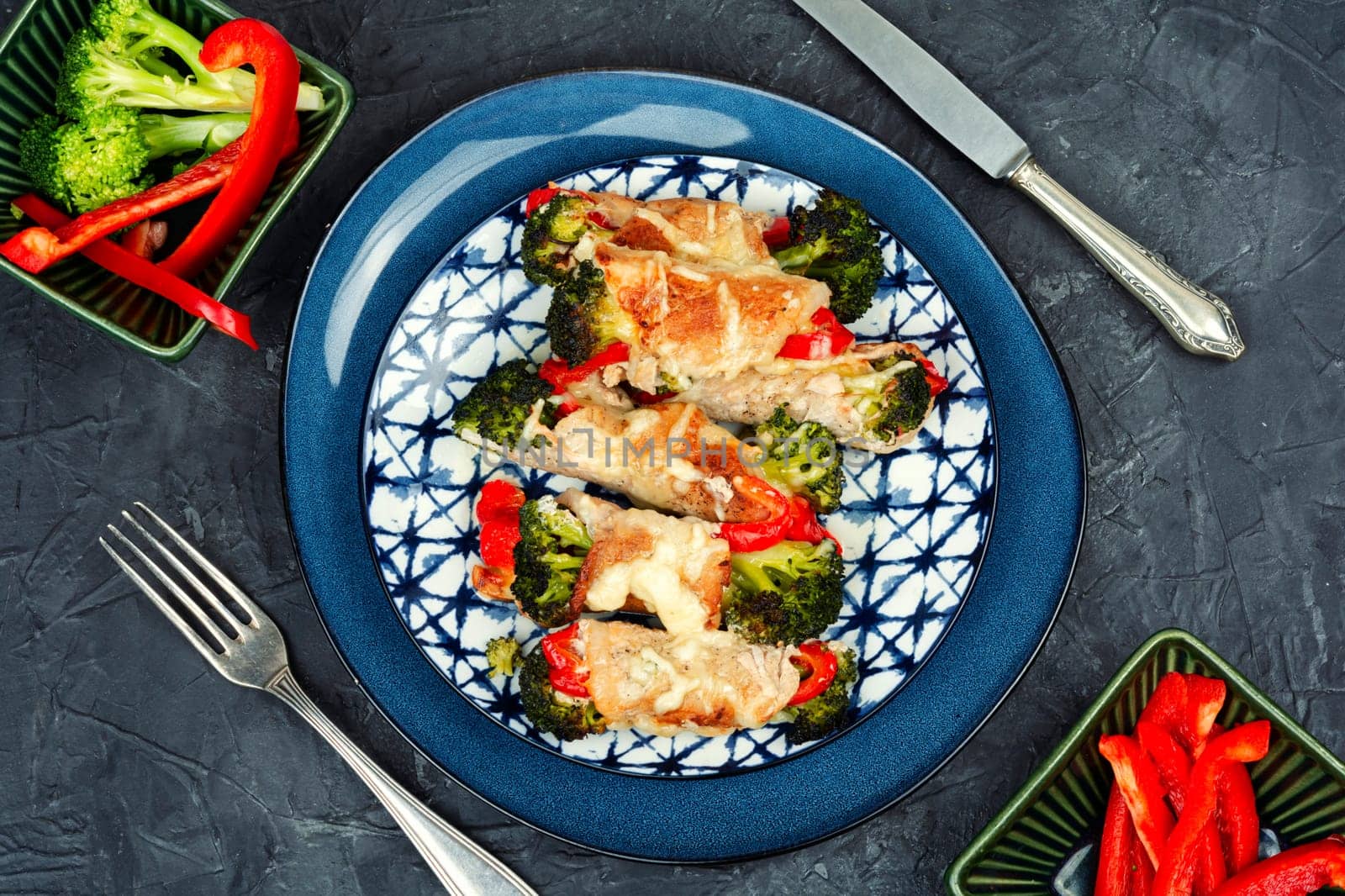 Tasty meat rolls or roulades stuffed with broccoli and peppers. Pork roll filled.