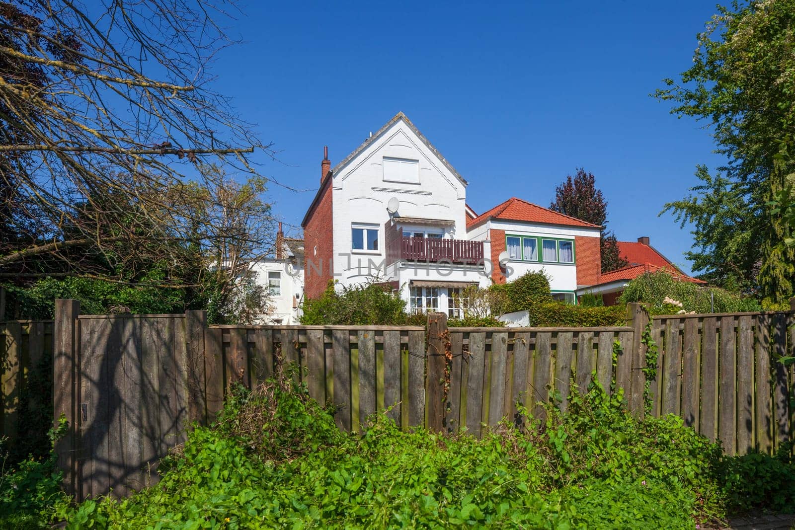Old residential building with garden fence, Leer, East Frisia, Lower Saxony, Germany