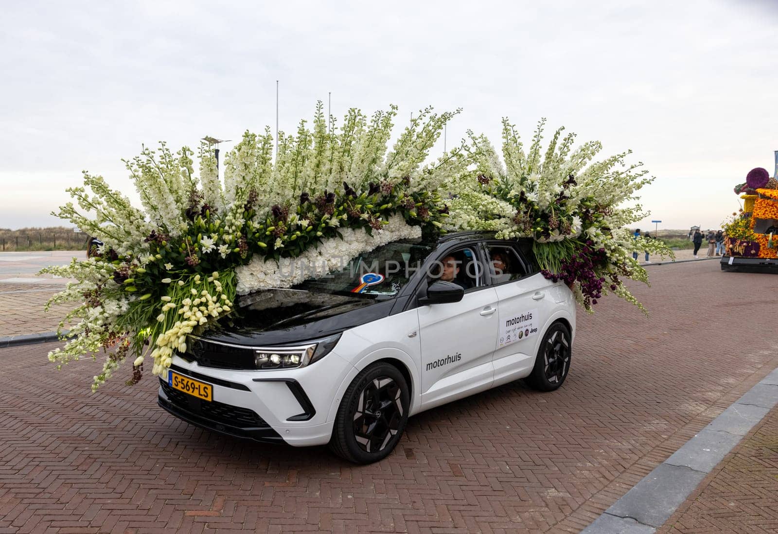 Noordwijk, Netherlands - April 22, 2023: Cars decorated with flowers taking part in the Bloemencorso Bollenstreek the annual spring flower parade from Noordwijk to Haarlem in the Netherlands.