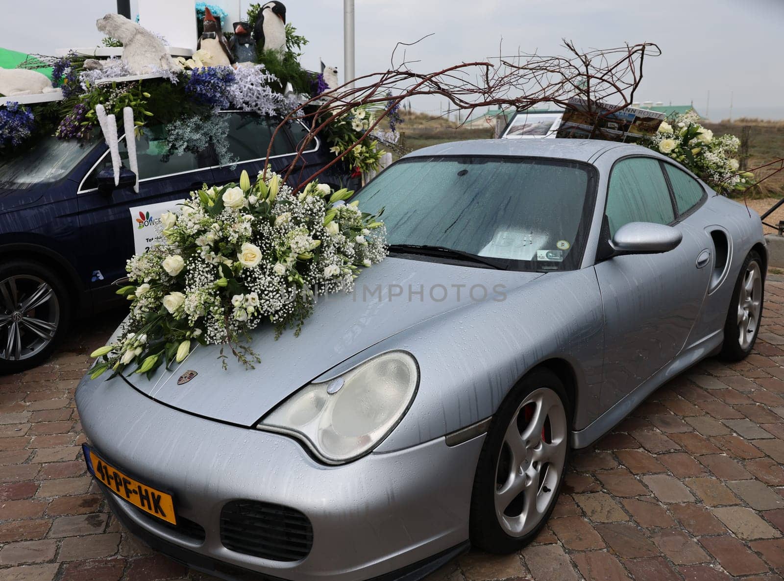 Noordwijk, Netherlands - April 22, 2023: Cars decorated with flowers taking part in the Bloemencorso Bollenstreek the annual spring flower parade from Noordwijk to Haarlem in the Netherlands.