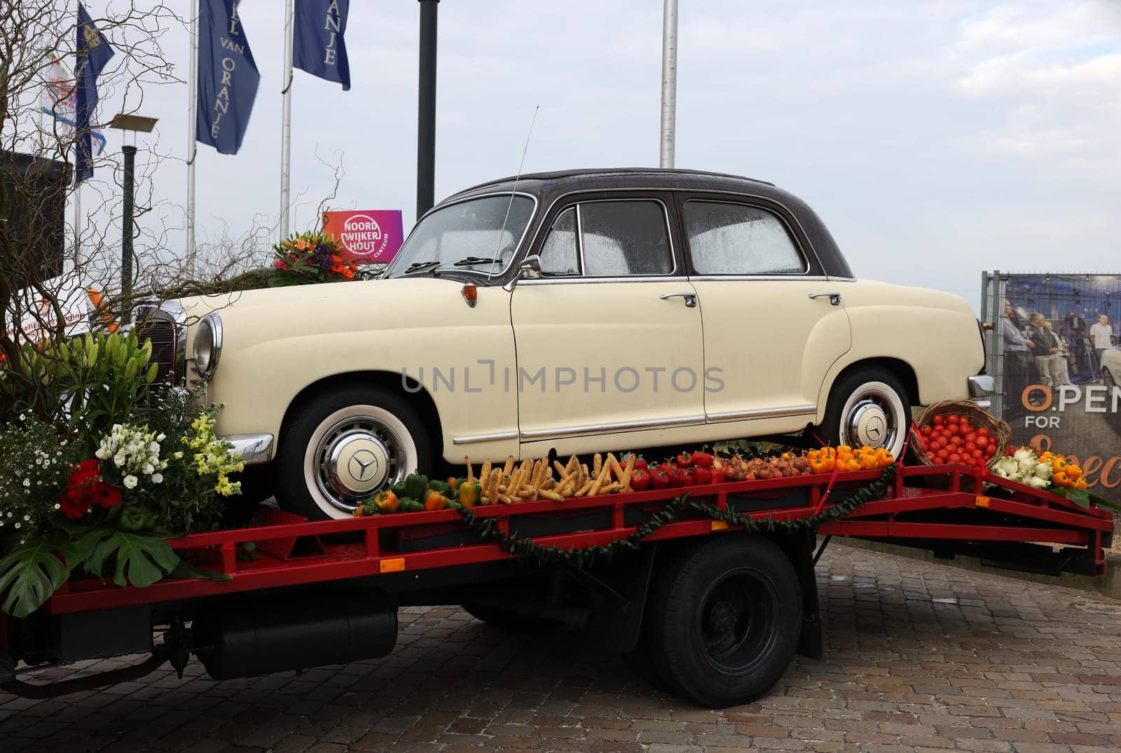 Noordwijk, Netherlands - April 22, 2023: Cars decorated with flowers taking part in the Bloemencorso Bollenstreek the annual spring flower parade from Noordwijk to Haarlem in the Netherlands.
