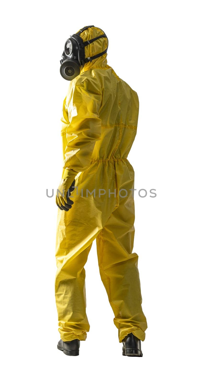 Professional hazmat suit worker standing in full body yellow protective gear with gas mask