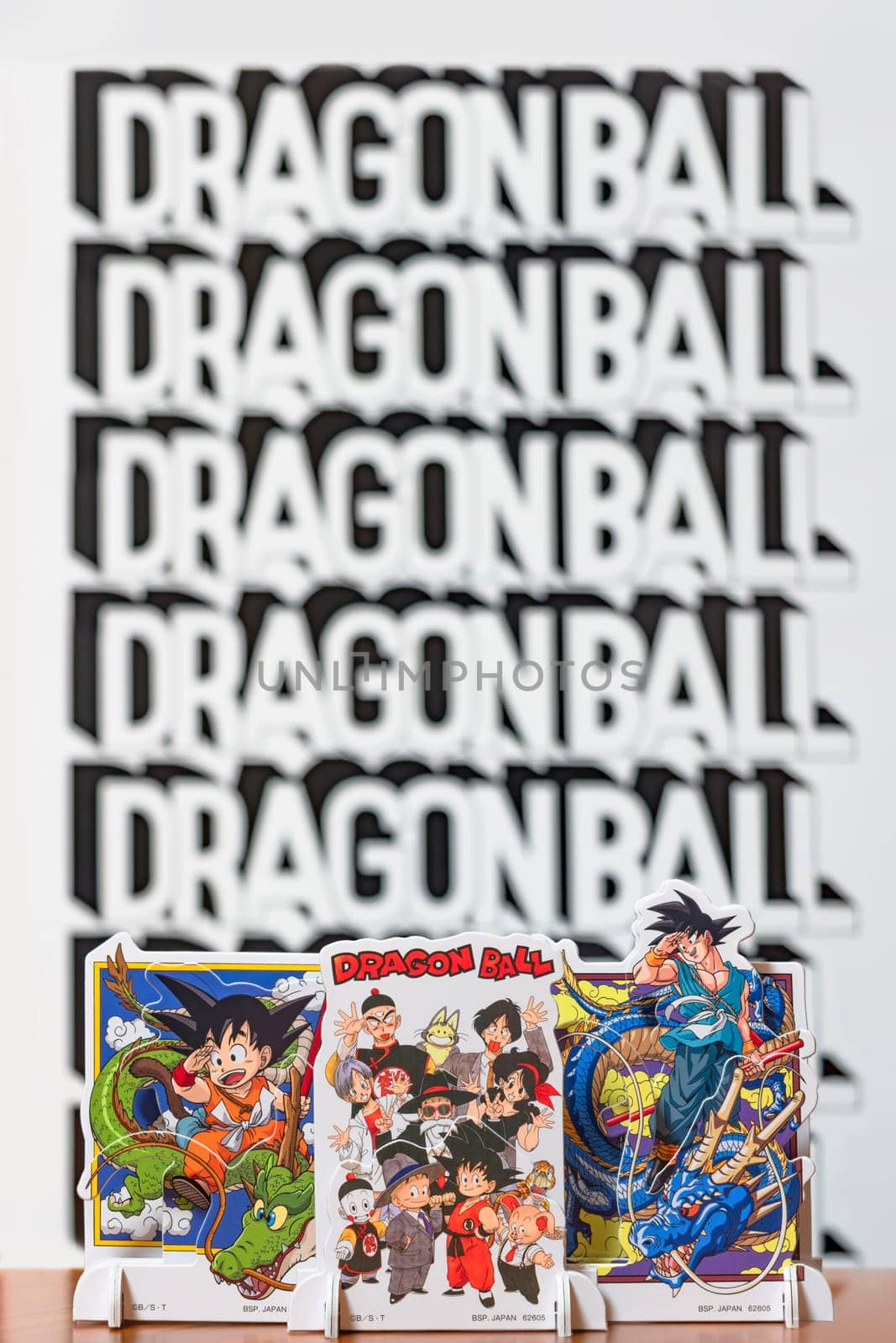japan, tokyo - mar 8 2024: Characters from the Dragon Ball manga and anime series bid farewell to the revered master, Akira Toriyama, by waving their hands against a bokeh background with the logo.