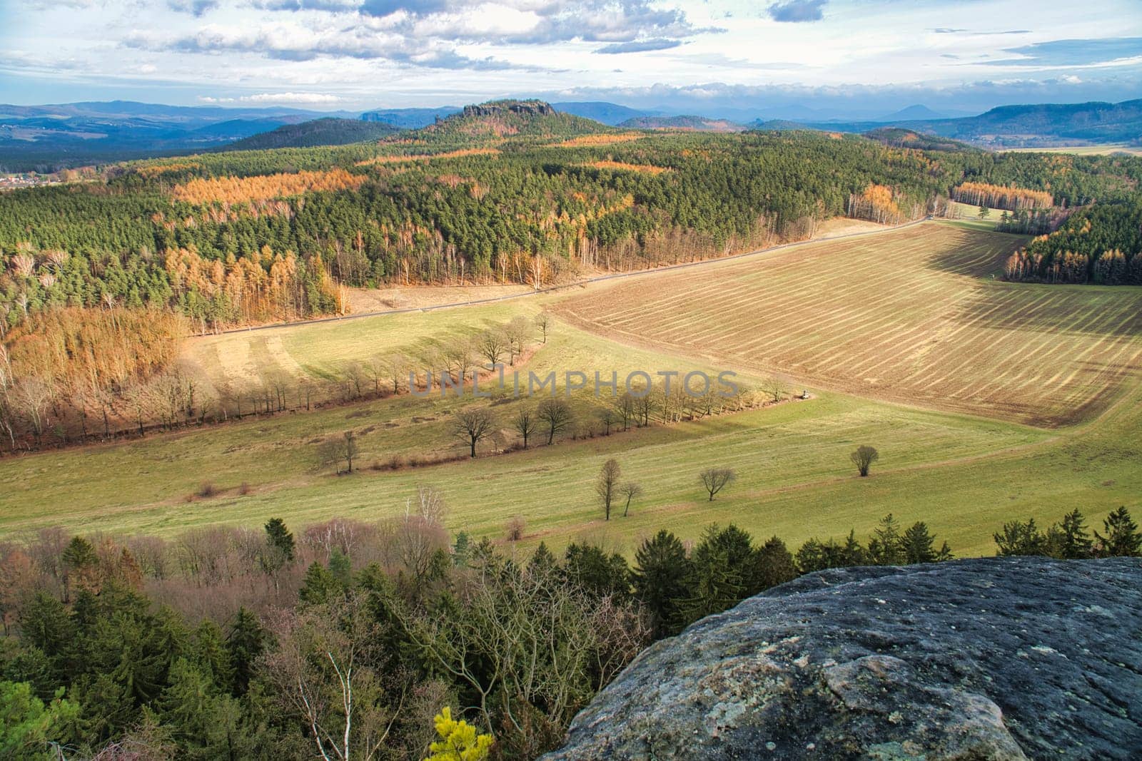 View from the Pfaffenstein. Forests, mountains, fields, vastness, panorama. Landscape from the Elbe Sandstone Mountains.