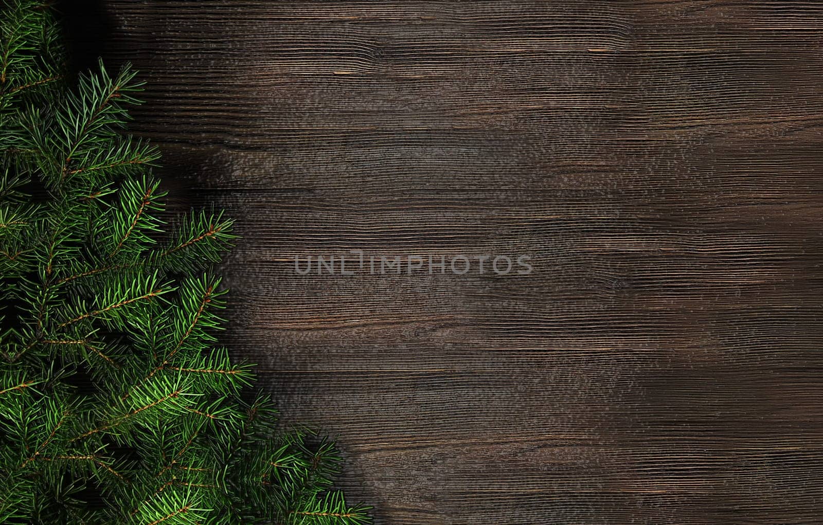 Spruce green branch on a natural brown wooden background with an empty space for text top view