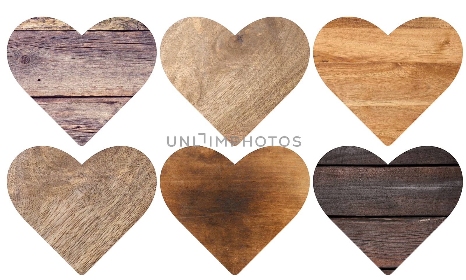 Heart figure carved from different types of wood on an isolated background
