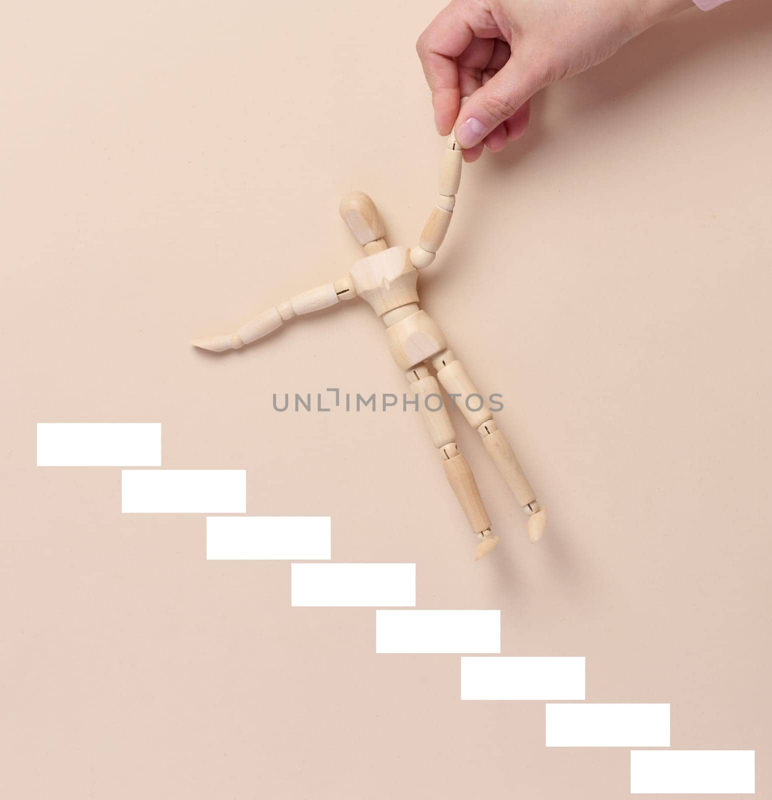 Steps and a woman's hand holding figurines, the concept of career growth, help and mentoring