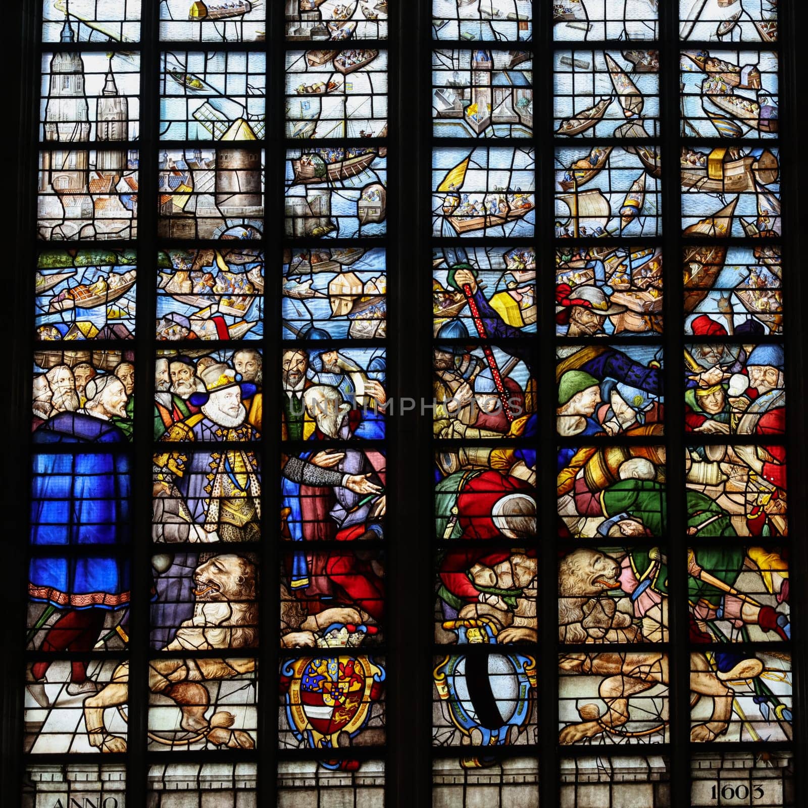 Gouda, the Nehterlands - April 20, 2023: The Stained glass window Siege of Leiden ends  by Isaac van Swanenburg in the Sint Janskerk in Gouda, the Nehterlands