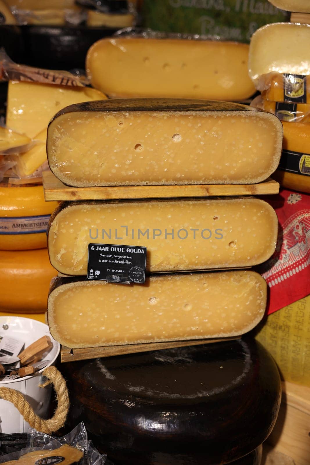 Gouda, the Nehterlands - April 20, 2023: Display of traditional Dutch cheese at local cheese shop in Gouda, the Netherlands