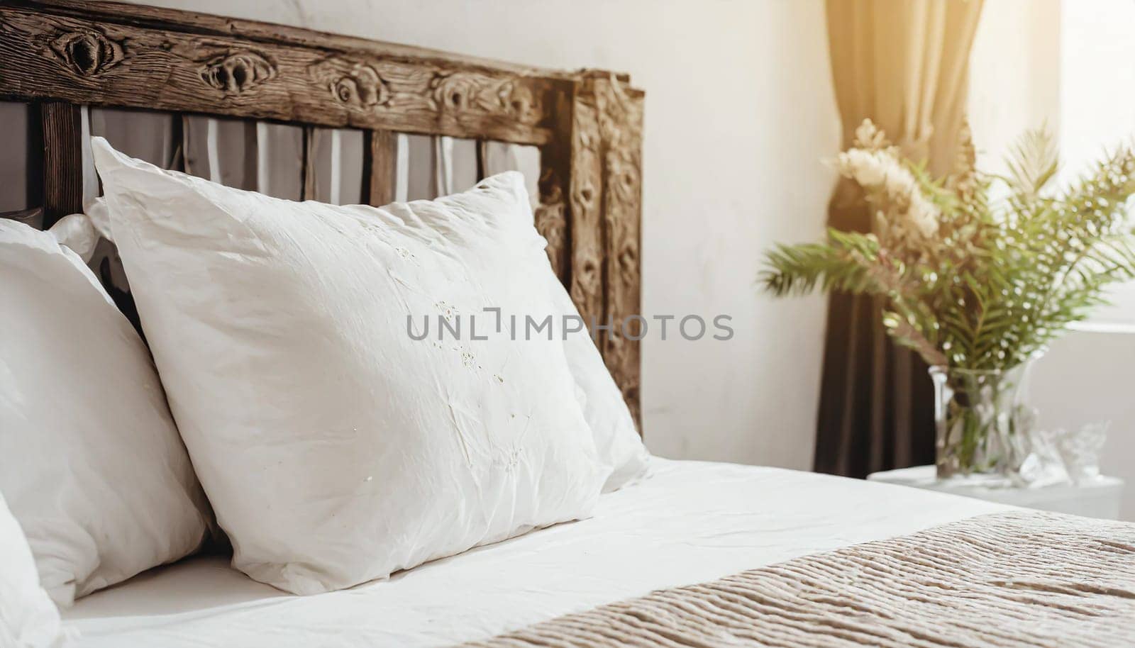 Clean Bedding sheets and pillow on natural wall room background. White bedding and pillow in hotel room. White pillows on empty bed.