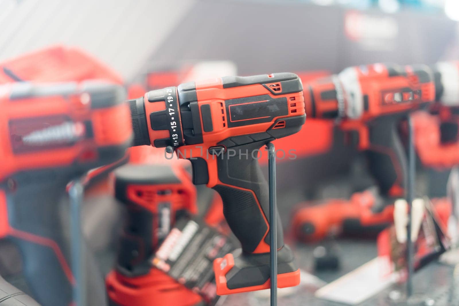 Power tools, drills and hammers of various manufacturers are sold in hardware store.