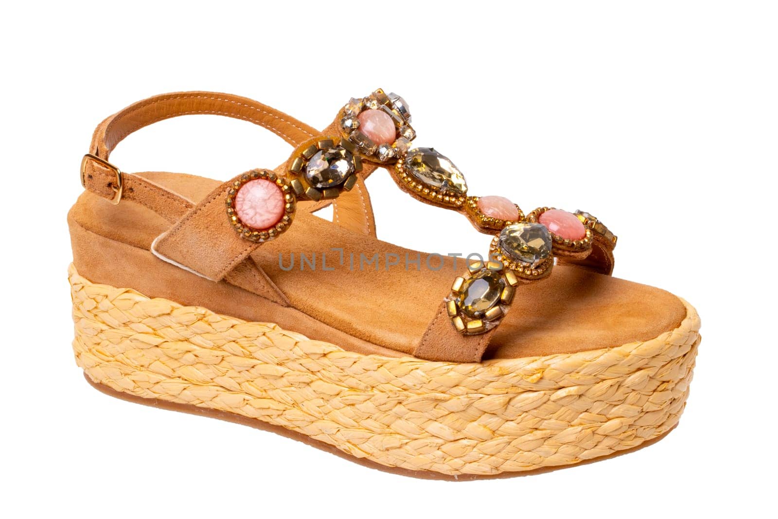 Leather shoes isolated. Close-up of a single of elegant female suede sandals with rhinestones. Isolated on white background. Macro.