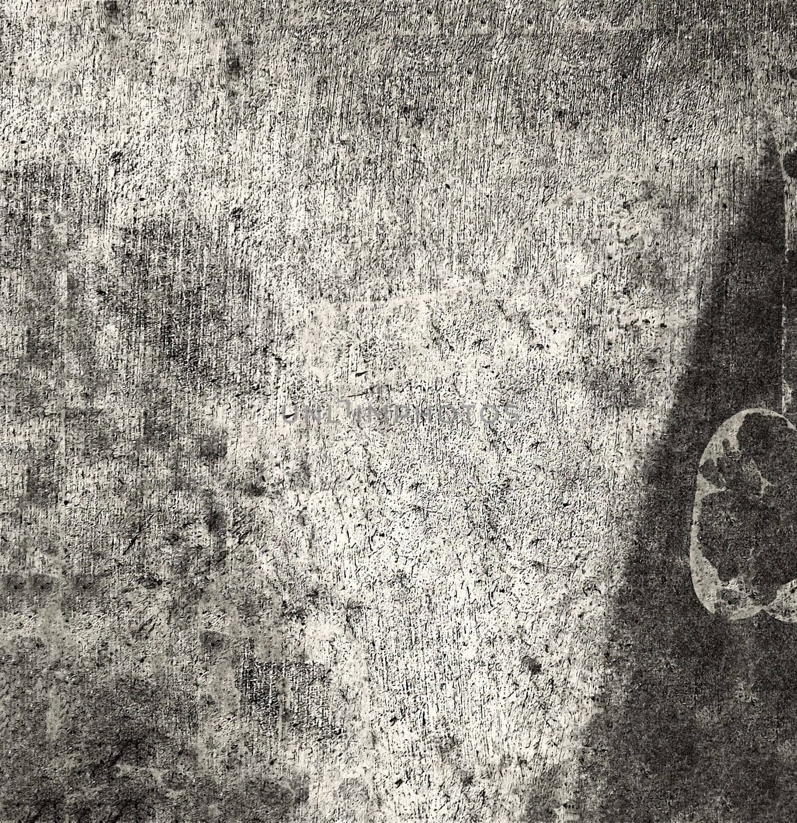 Old background texture of a black and gray wall with spots and roughness on the surface close-up