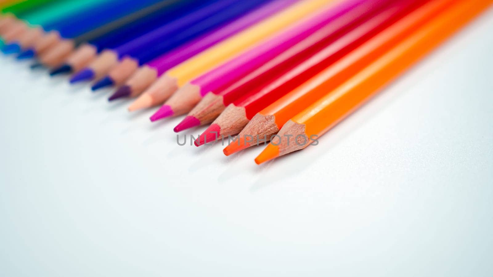 Set of colored pencils on a white background That is arranged in a bar graph, Color pencils on white background, Close up, seamless colored pencils row with wave on lower side, line pencils.