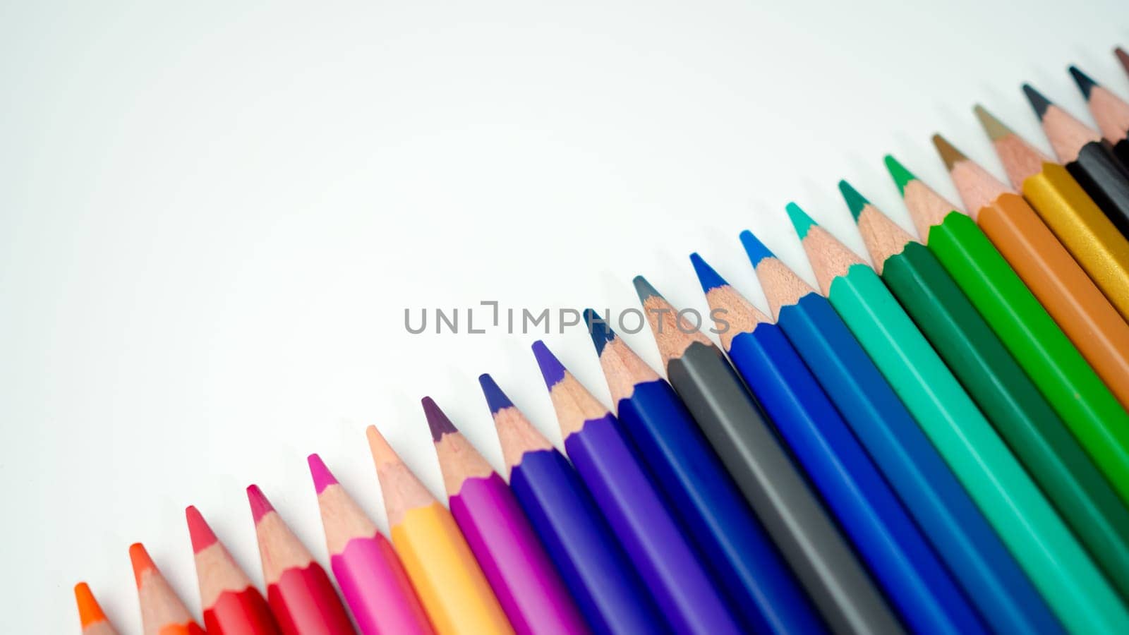 Set of colored pencils on a white background That is arranged in a bar graph, Color pencils on white background, Close up, seamless colored pencils row with wave on lower side, line pencils.