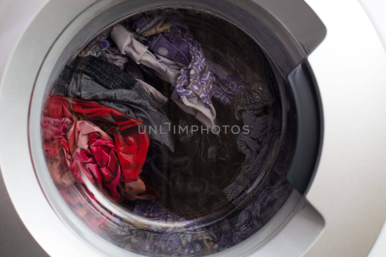 a close view of domestic washing machine at work.