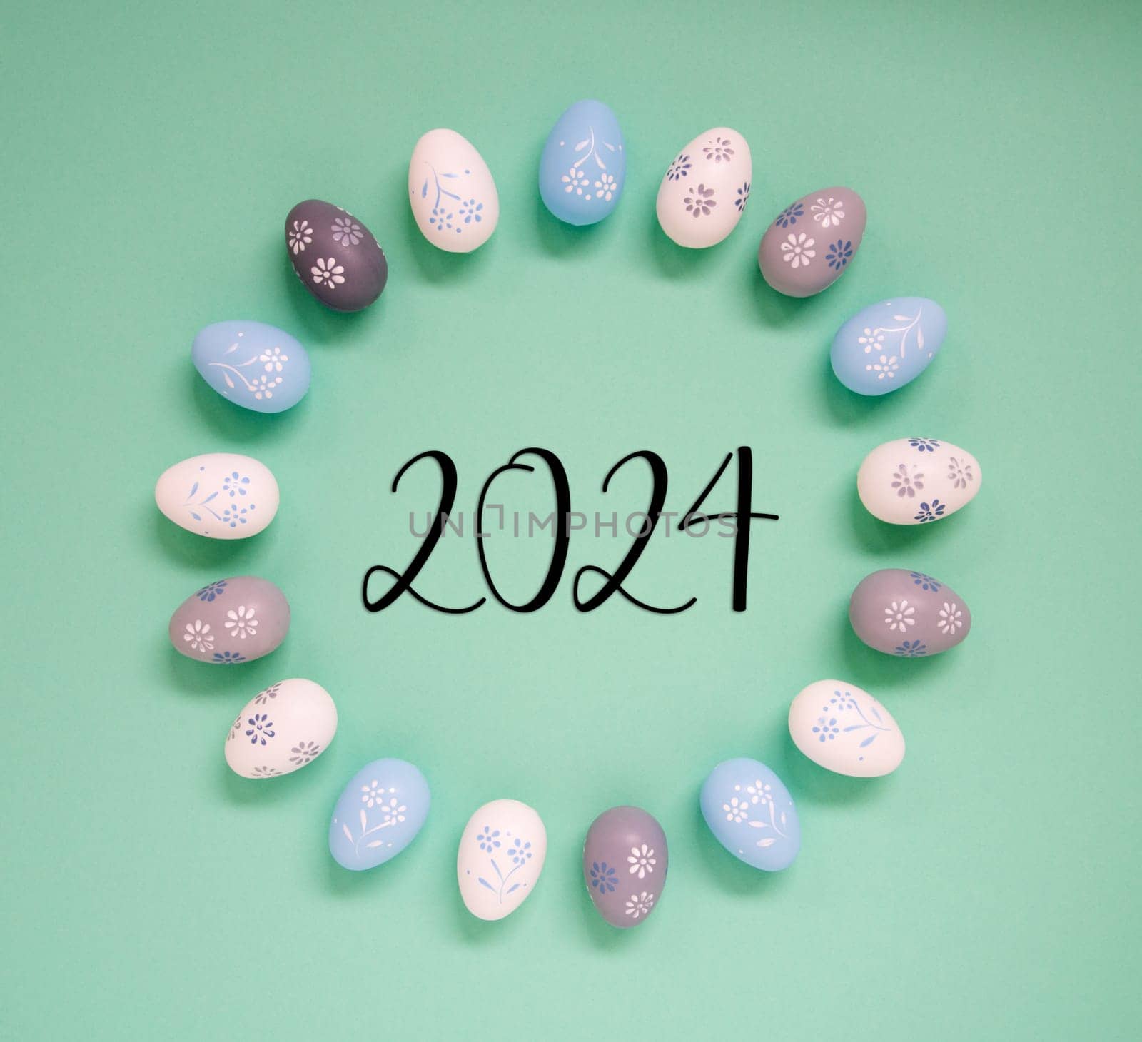 Flat Lay With Text 2024. Easter Egg Arrangement, Decoration And Ornament. Light Green Paper Background
