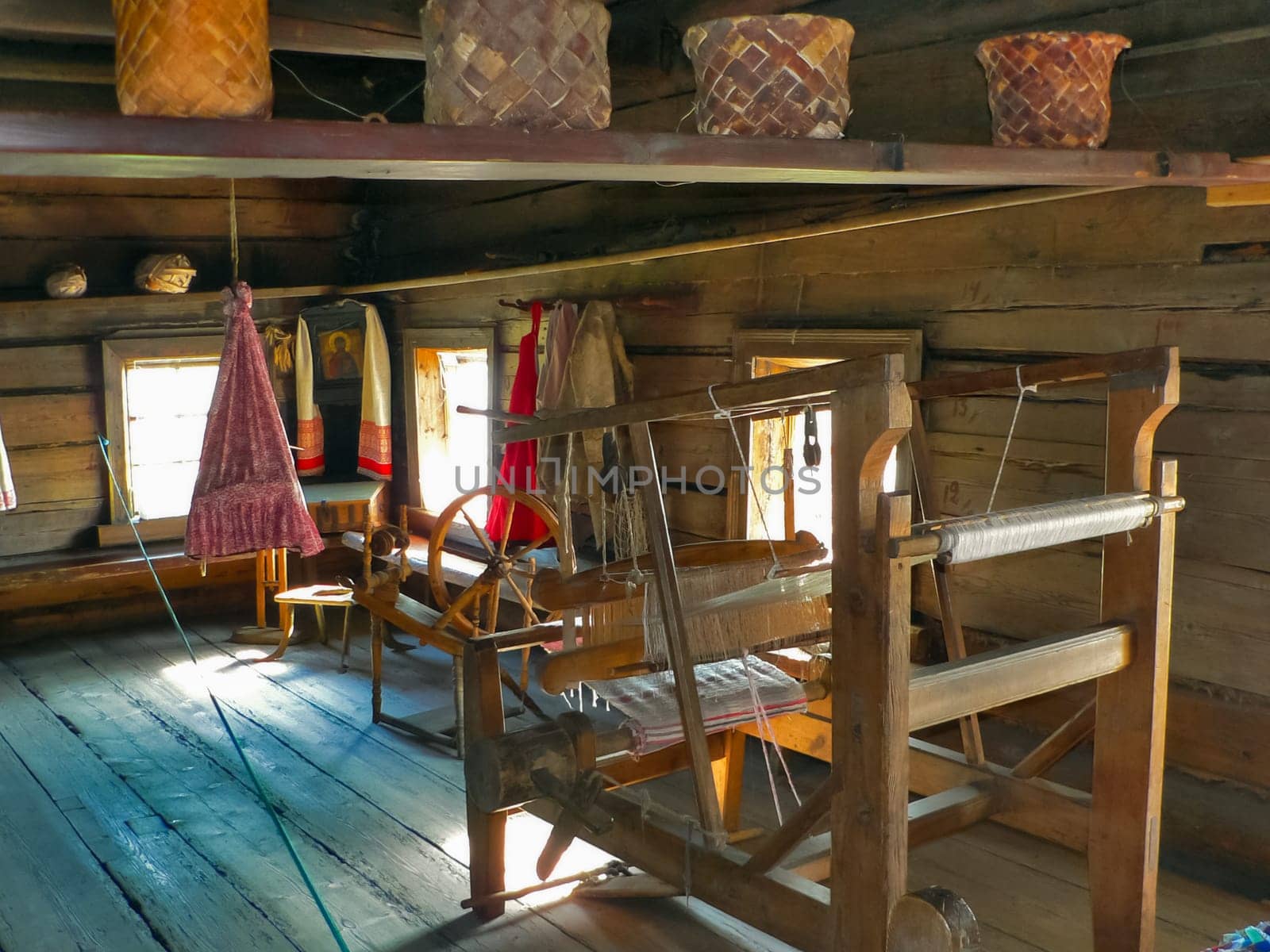 Wooden antique loom in a wooden house Wooden antique loom in a wooden house