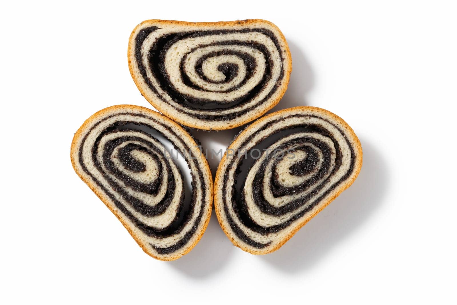 Explore the three of German poppy seed cake slices, each boasting a moist texture and flavorful poppy seed filling, set against a pristine white background.