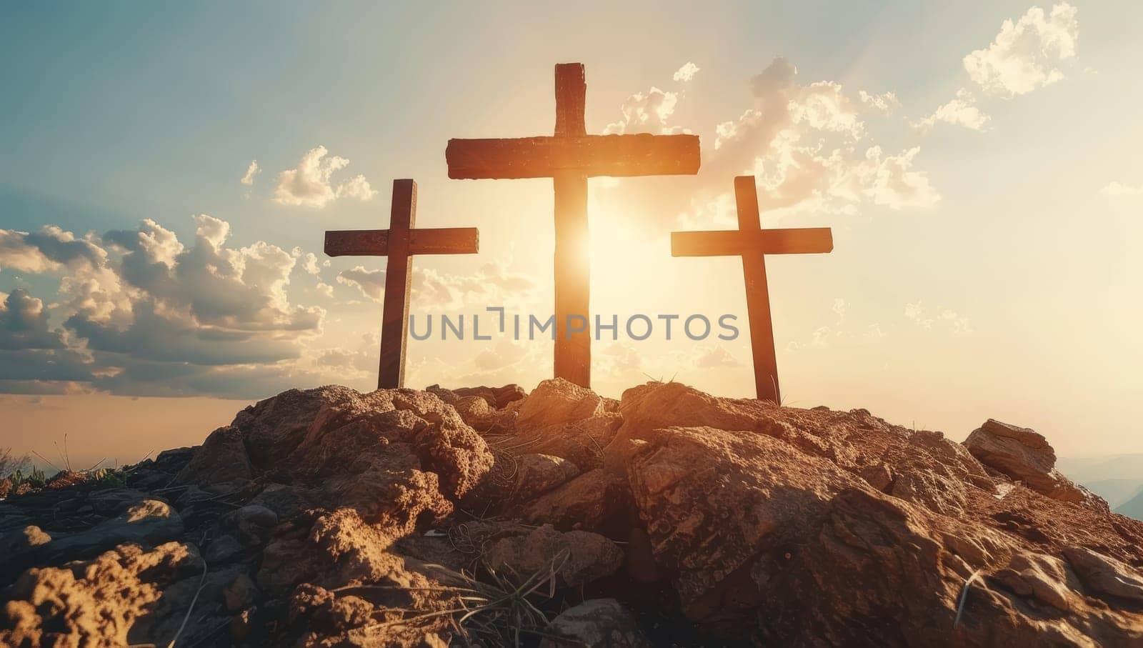 Crosses on the top of the mountain in the rays of the rising sun