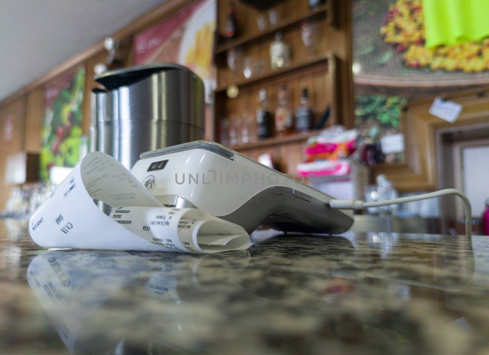 Payment terminal over bar counter. Focus numeric keyboard