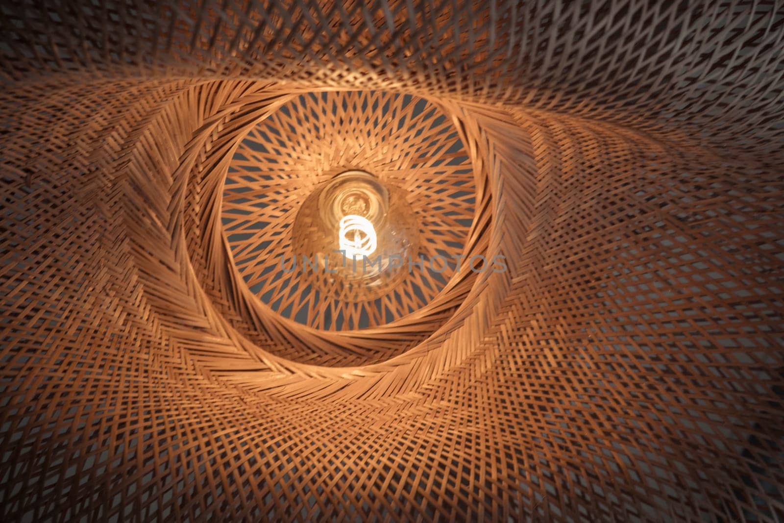Low angle view of geometric lamp in warm glow
