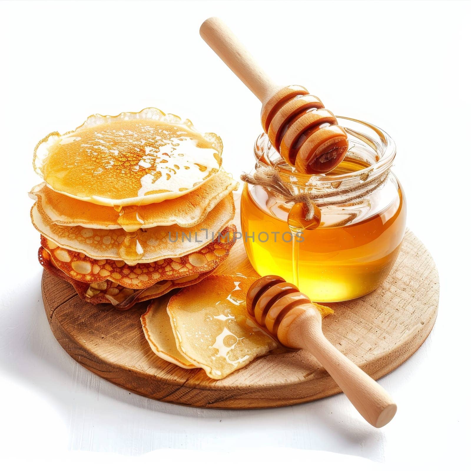 A stack of fluffy pancakes drizzled with golden syrup sits on a wooden plate. A wooden spoon rests beside the pancakes