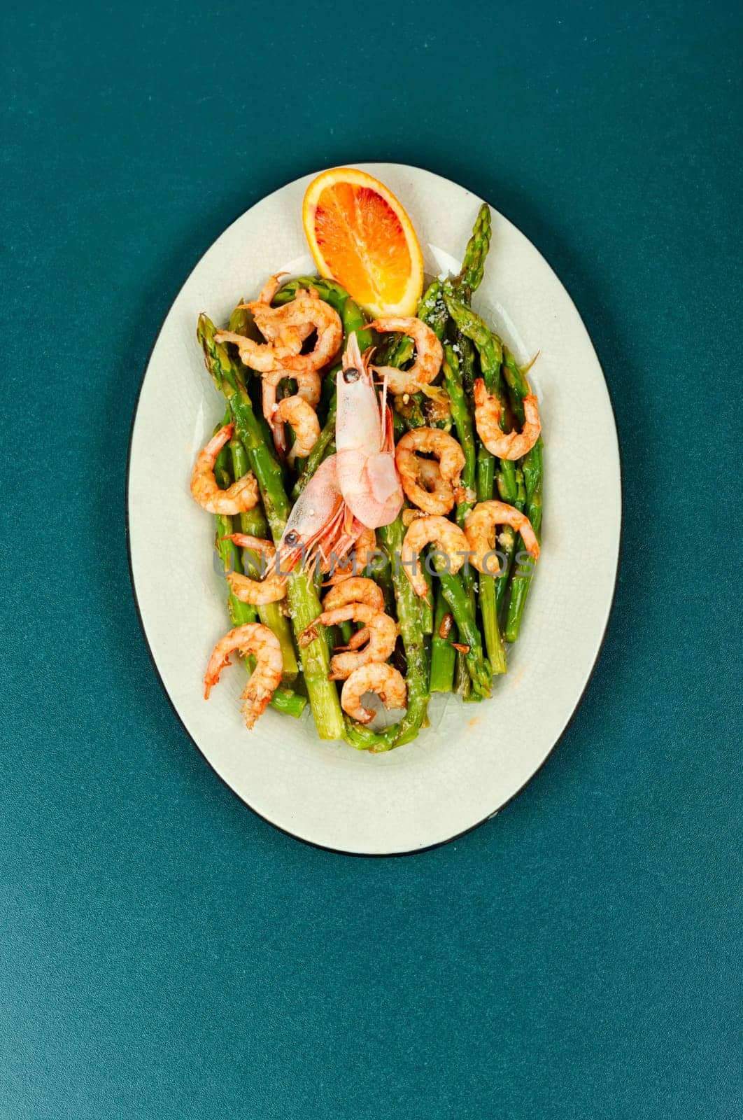 Delicious boiled shrimp with green asparagus. Ready to eat. Space for text.