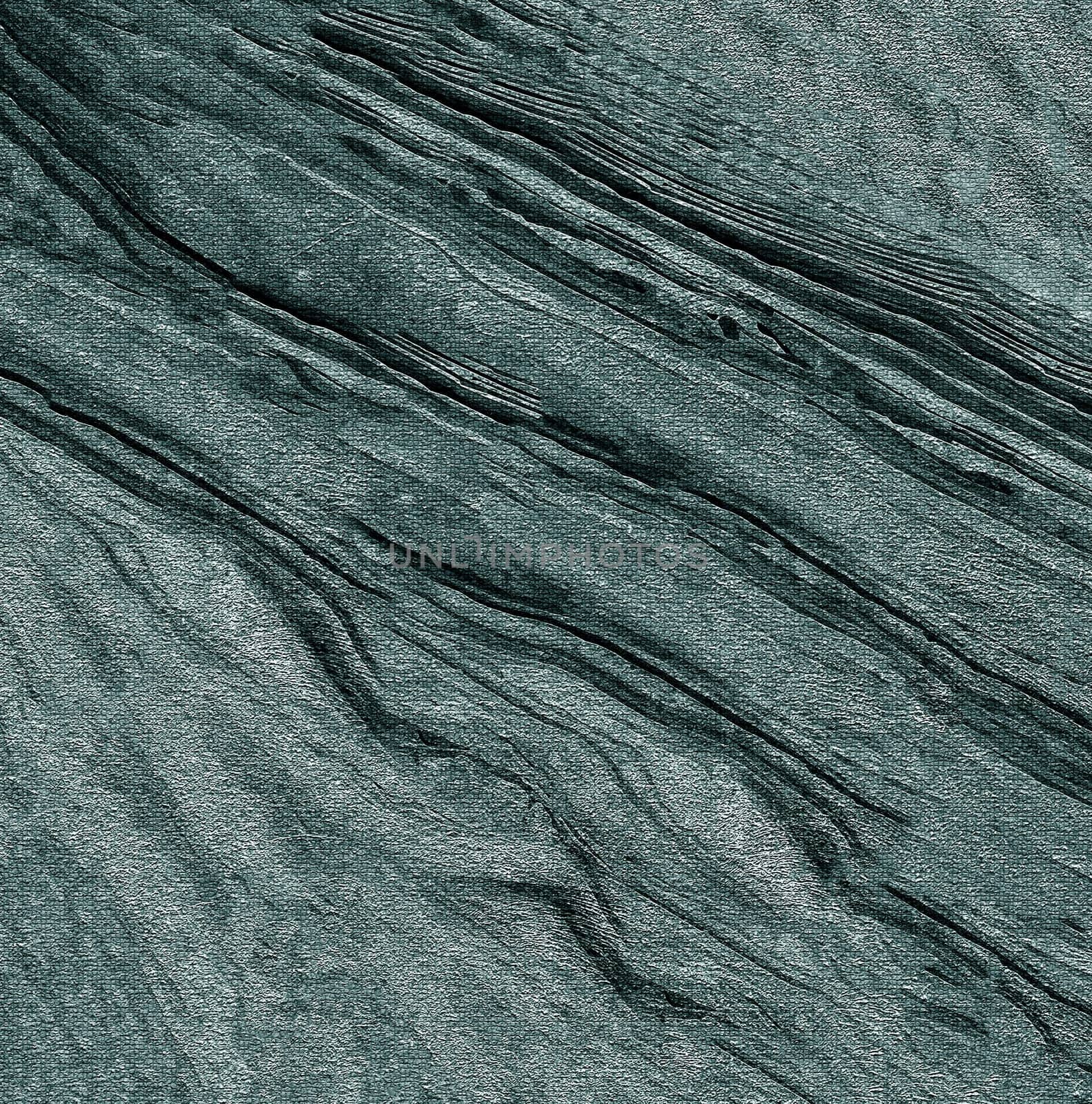 A solid relief surface made of a rough gray base with uneven depressions and lines .Texture or background
