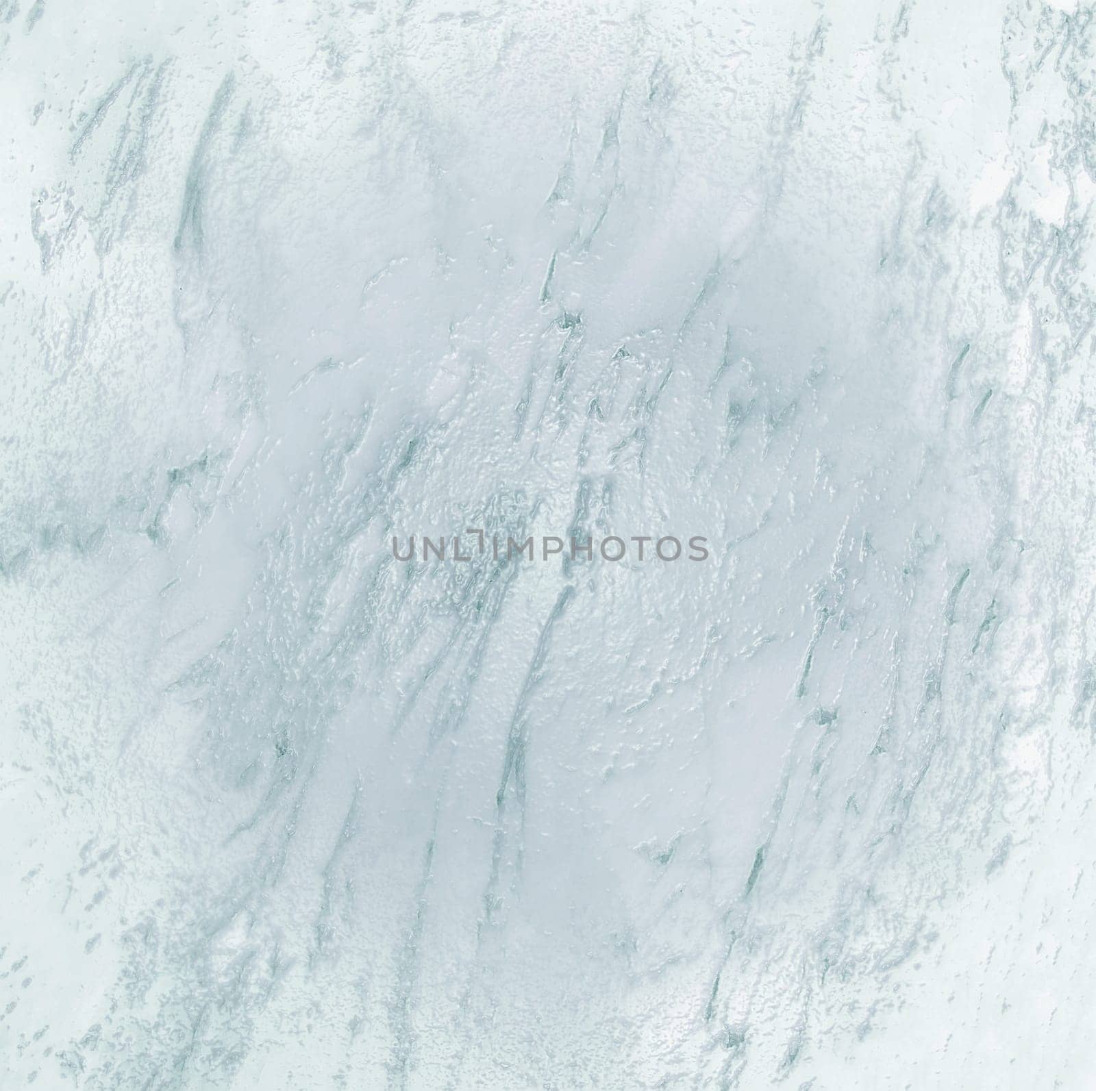 The background is made of white marble with a gray natural pattern and a glossy bulge in the center of the frame