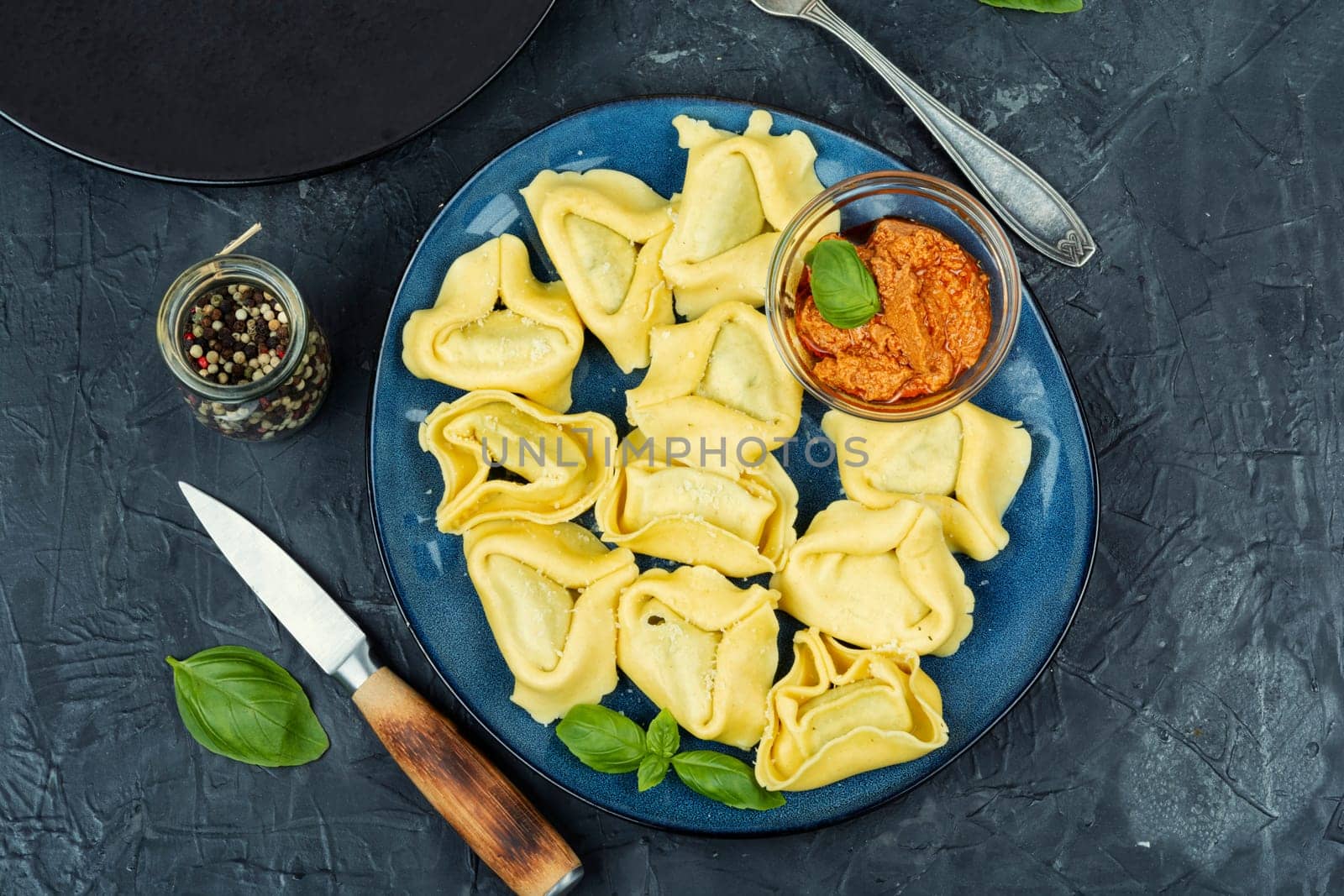 Tortelloni stuffed with ricotta cheese and basil pesto.