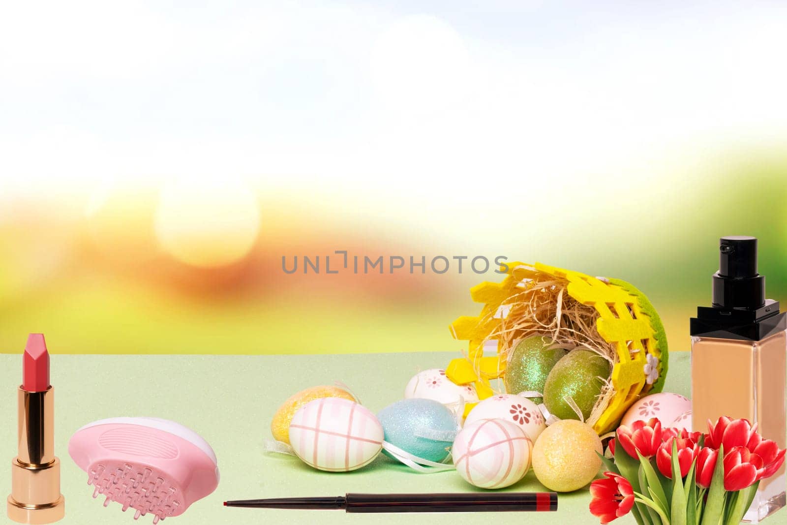 Happy Easter greeting card template. Closeup of colorful easter eggs and basket and various cosmetics gifts on table over abstract blurred natural spring background. Space.