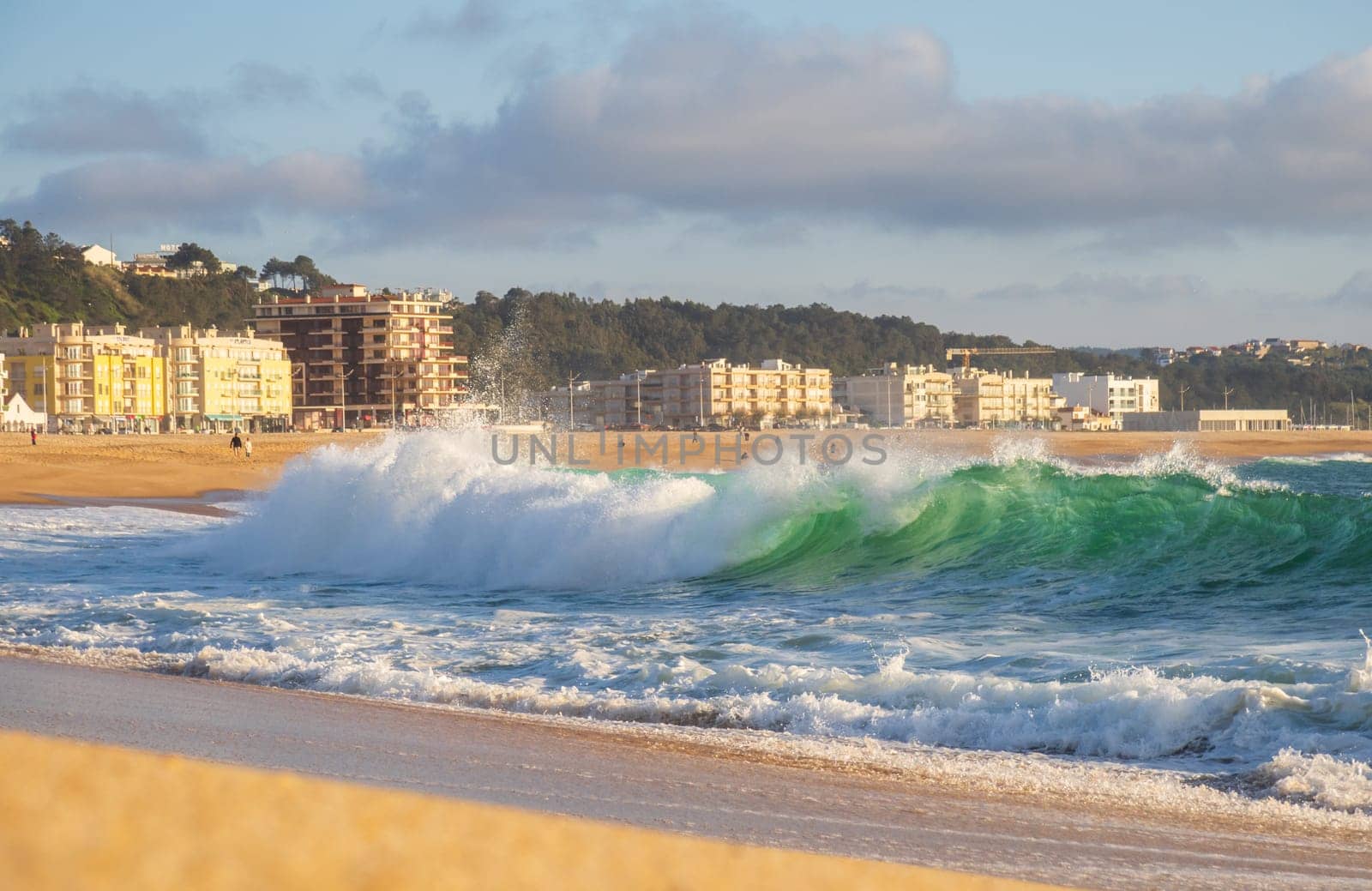 Big wave in Atlantic Ocean on the beach in Nazaré, Portugal.
