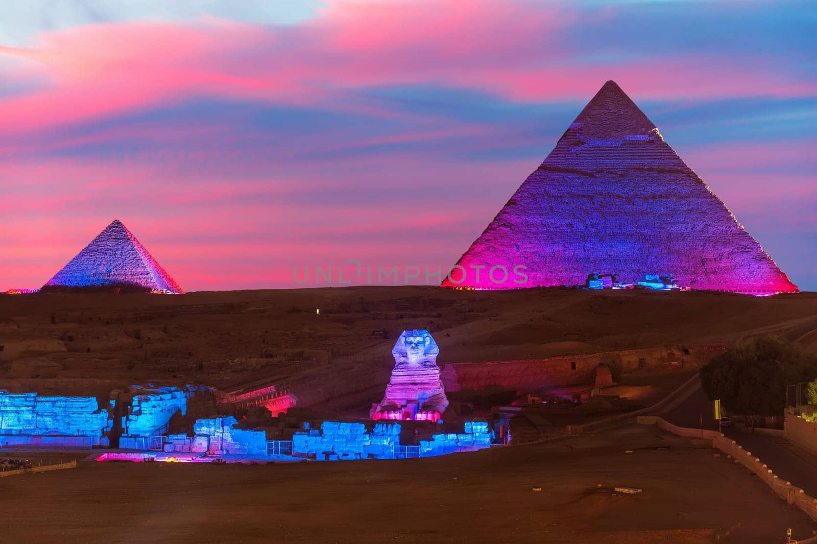 The Pyramid of Egypt and the great Sphinx night view in the lights, Giza.