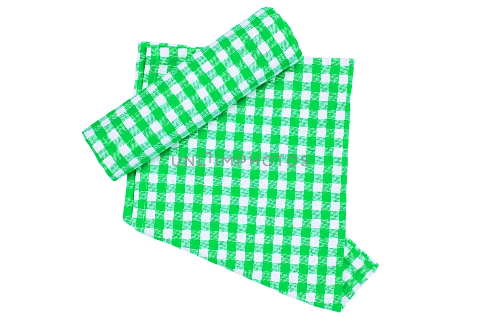 A green white checkered napkin or picnic tablecloth texture with a rolled towel isolated on white. Kitchen towels. Backdrop for your product placement or montage.