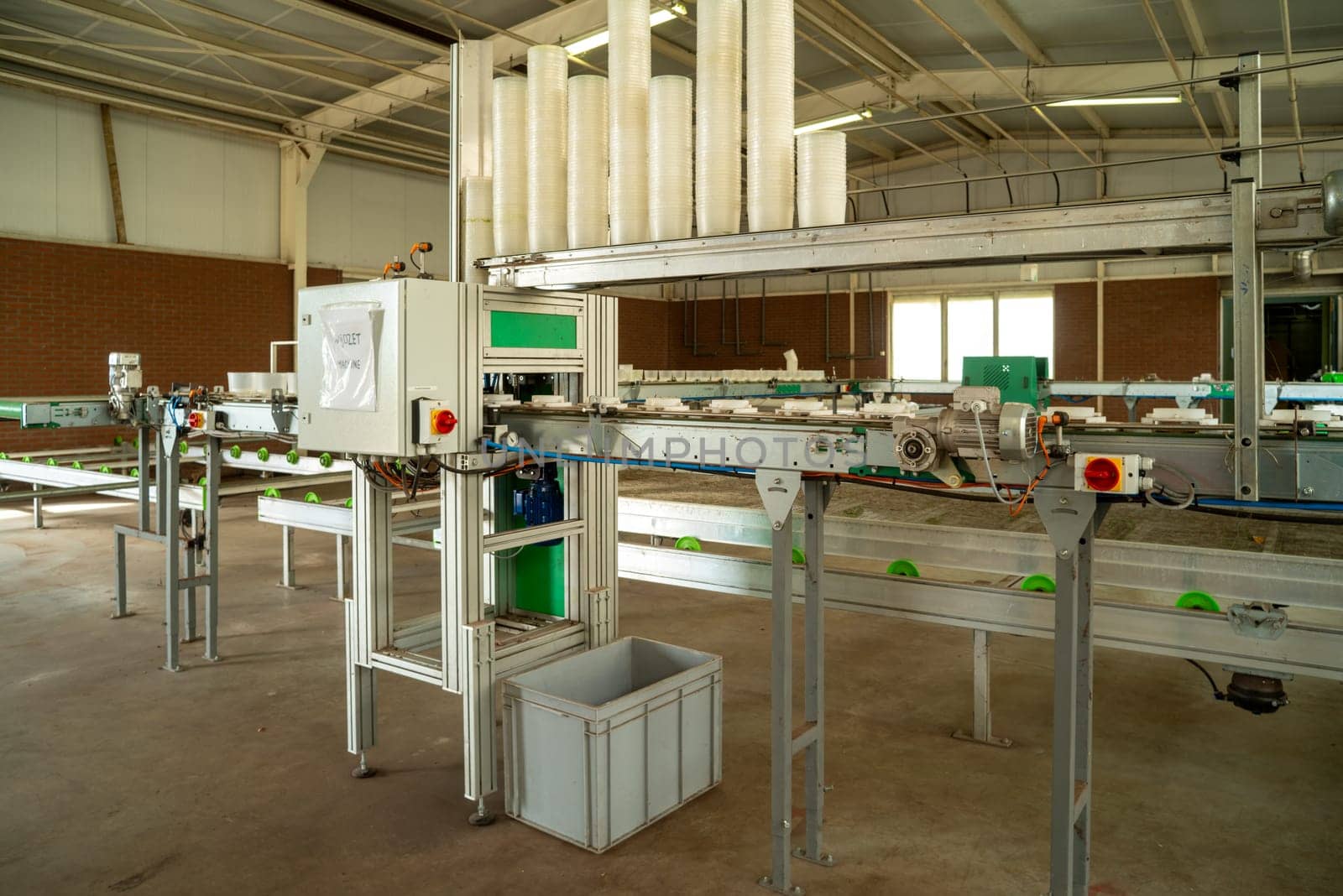 KLAZIENAVEEN, NETHERLANDS - APRIL 7, 2018: Automated device with a conveyor-belt in a commercial greenhouse