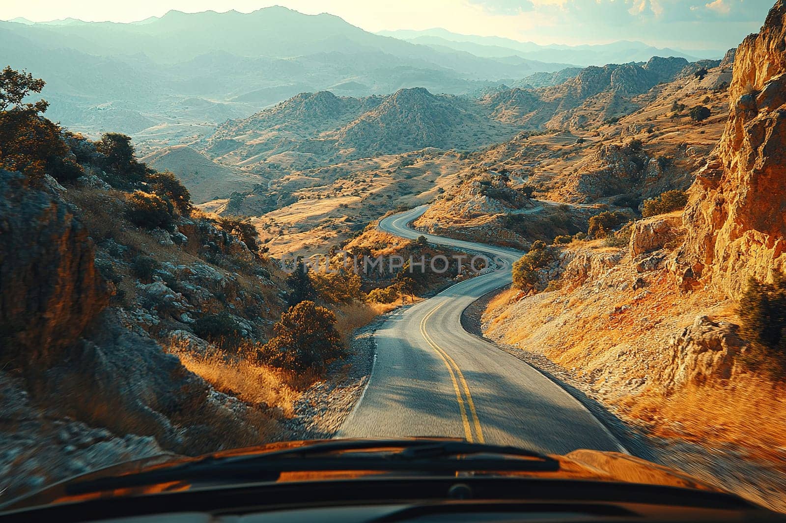 View from the car window onto a deserted mountain serpentine. Travel concept