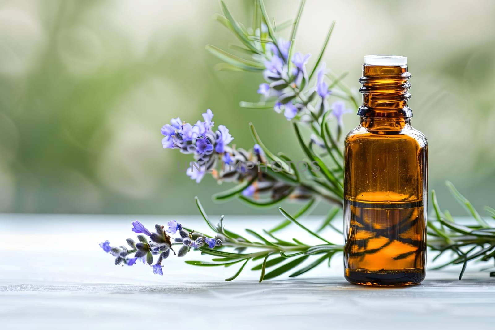 A bottle of essential oils sits next to a bunch of blooming lavender flowers, showcasing natural aromatherapy. The vibrant purple petals contrast with the sleek glass bottle, evoking a sense of relaxation and wellness.