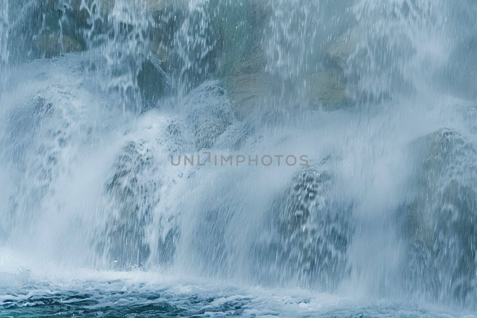 A man is skillfully riding a surfboard in the majestic setting of a powerful waterfall. The surfer is seen gliding on the water, balancing his movements as he gets ready to catch a wave. The waterfall provides a stunning backdrop to this thrilling water sport activity.
